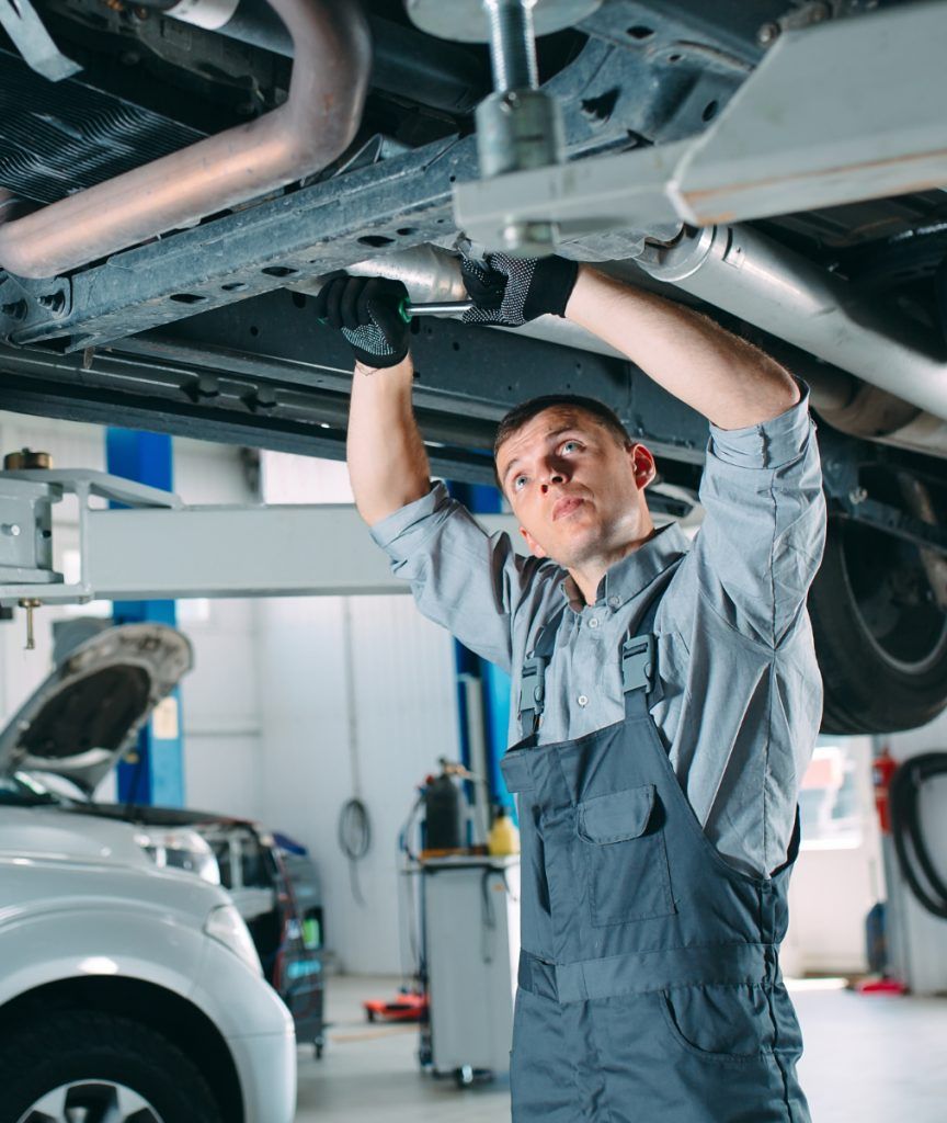 Mechanic underneath a vehicle during a repair - MOT, Servicing, Repairs & Commercial Vehicles in Southampton